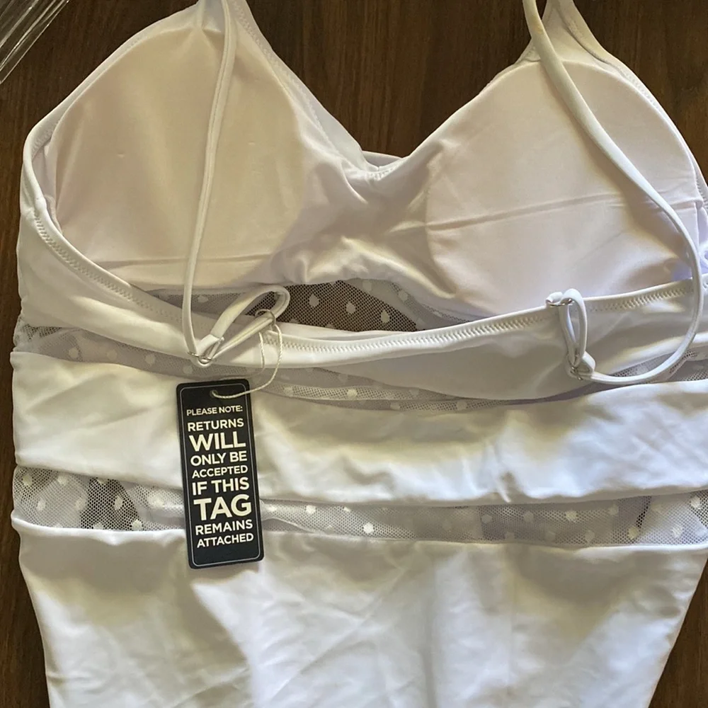 This is ladies swimming suit with pads‎ in the bust area .This suit is new .